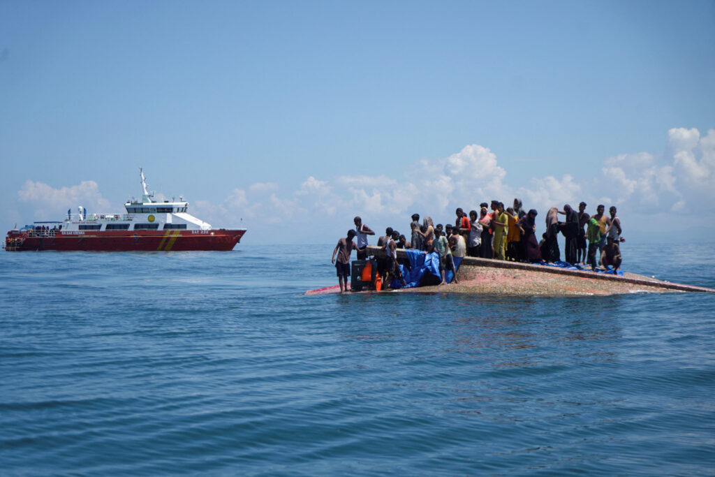 Rohingya refugees travelling by boat across the Bay of Bengal amid the ongoing humanitarian crisis.